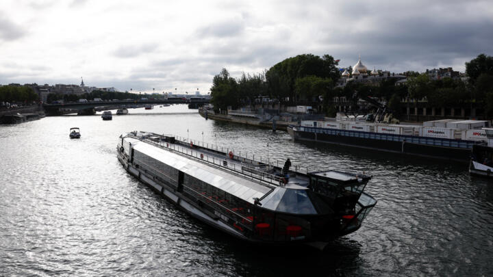 A flotilla of boats cruises on the Seine river during a test for the Paris 2024 Olympic Games opening ceremony in Paris, France on June 17, 2024.